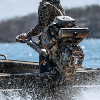 close up of gator tail mud motor on custom camo boat